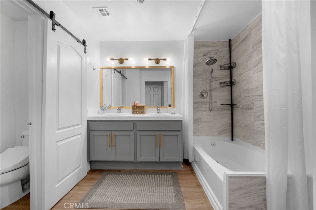 1572 Hackberry Place Chula Vista, CA 91915 - Photo 23 of 38 a bathroom with a tub sink and mirror