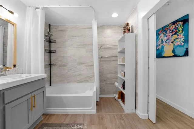 a bathroom with a tub and a shower