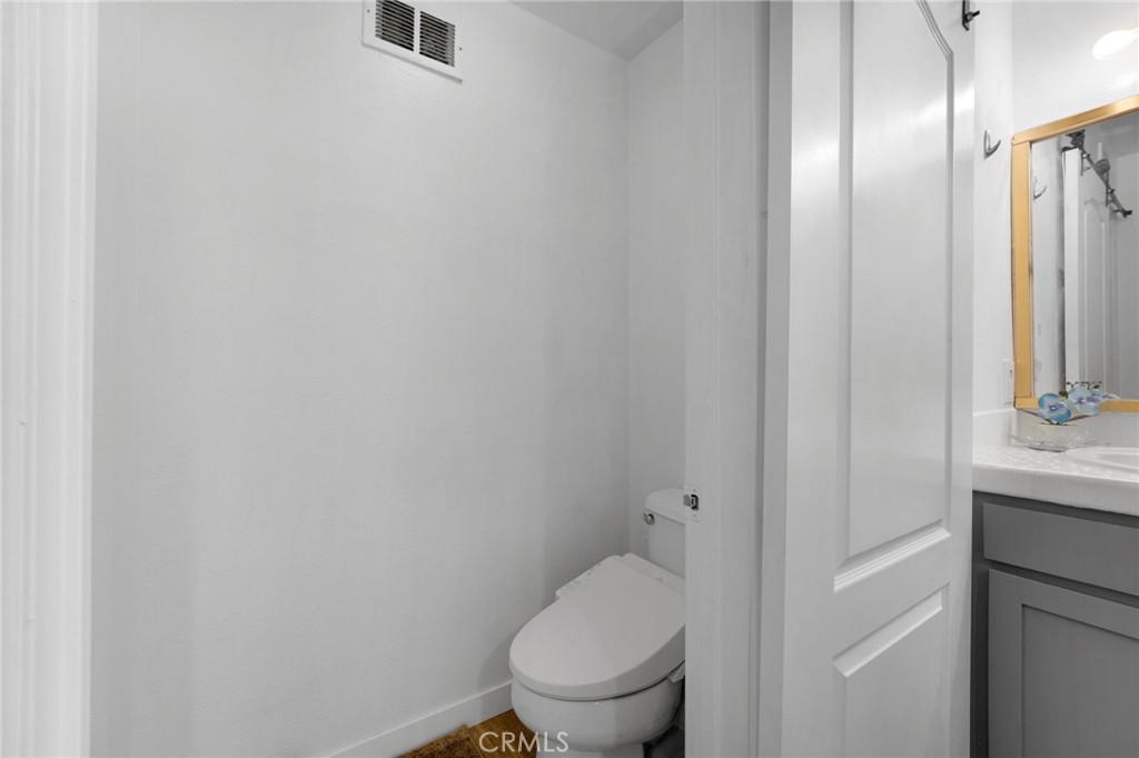1572 Hackberry Place Chula Vista, CA 91915 - Photo 25 of 38 a white toilet sitting next to a bathroom sink