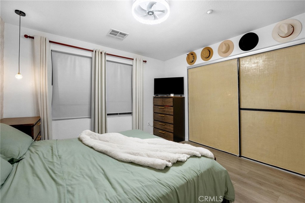 1572 Hackberry Place Chula Vista, CA 91915 - Photo 28 of 38 a bedroom with a bed and a dresser