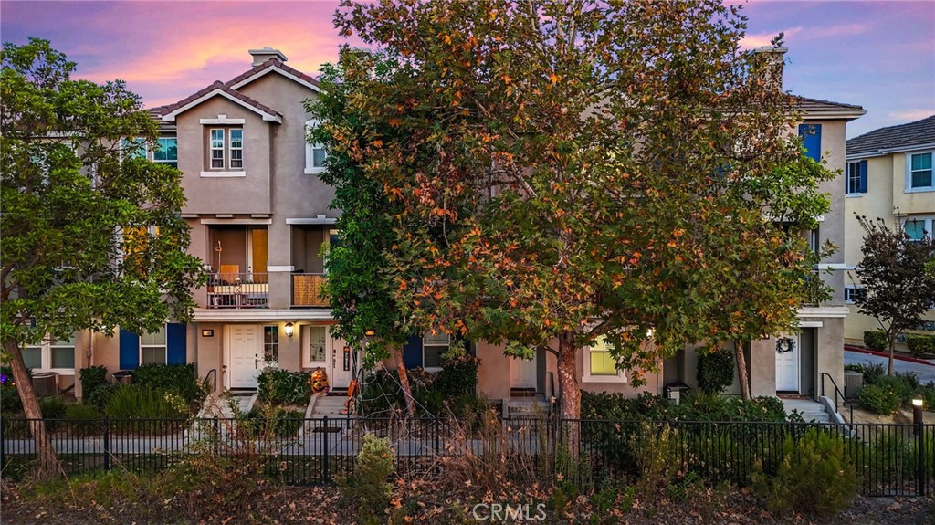 1572 Hackberry Place Chula Vista, CA 91915 - Photo 32 of 38 a front view of a house with a yard and tree s