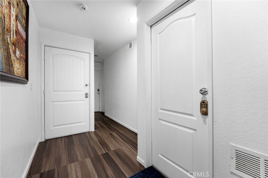 1572 Hackberry Place Chula Vista, CA 91915 - Photo 5 of 38 a view of a hallway with wooden floor and closet