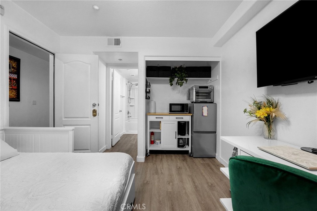 1572 Hackberry Place Chula Vista, CA 91915 - Photo 7 of 38 a bedroom with a bed and a flat screen tv