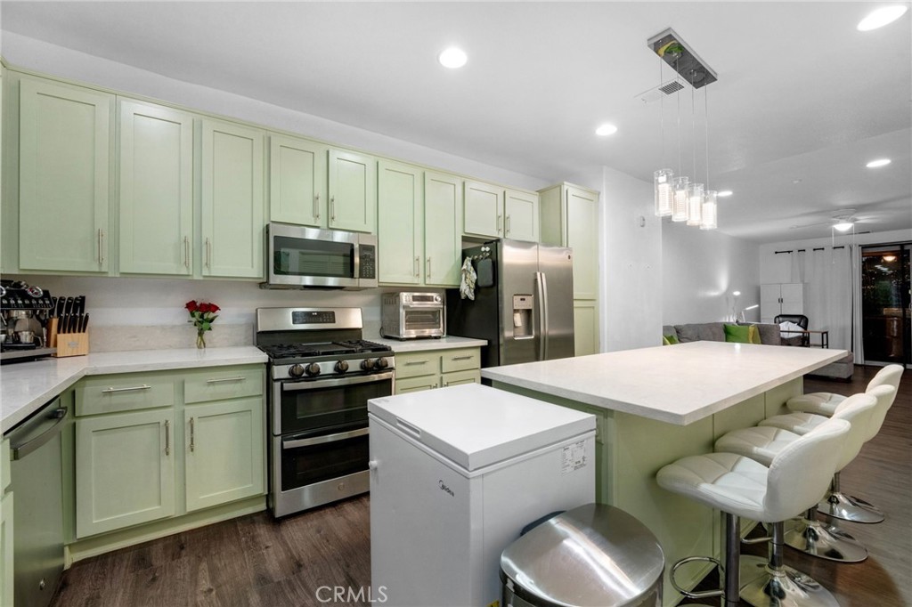 1572 Hackberry Place Chula Vista, CA 91915 - Photo 10 of 38 a kitchen that has a cabinets counter space and appliances
