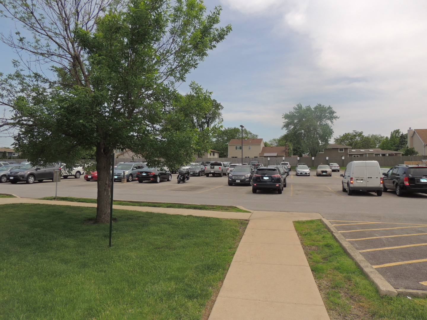 962 North Rt 53, Unit 101B Addison, IL 60101 - Photo 3 of 36 a view of road with card parked on side and building