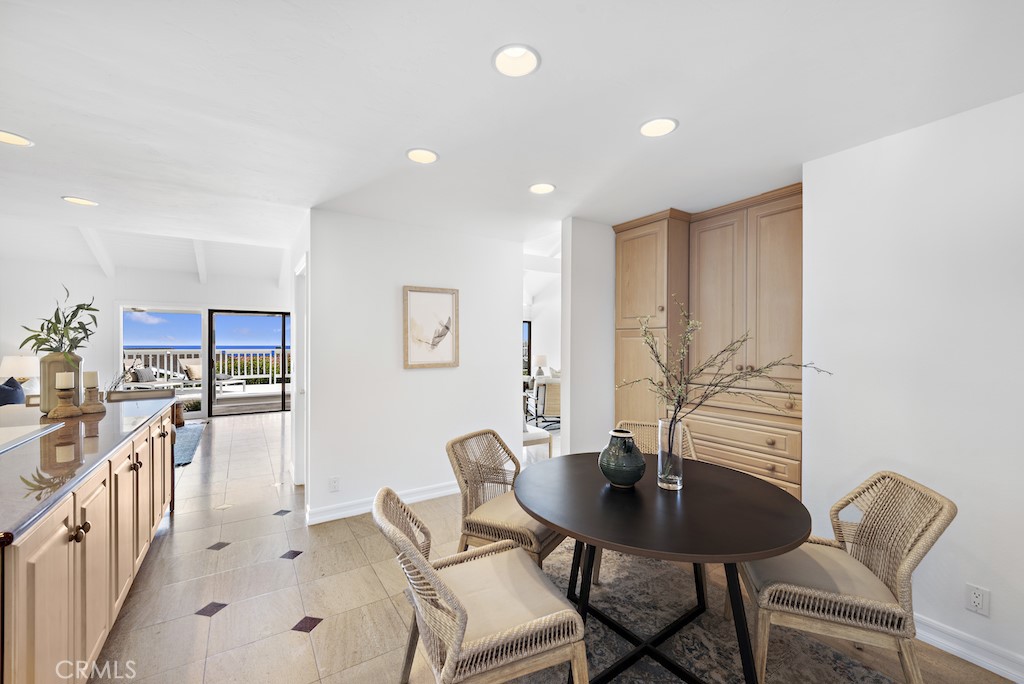 23242 Palawan Circle Dana Point, CA 92629 - Photo 12 of 34 a view of a dining room with furniture and a potted plant