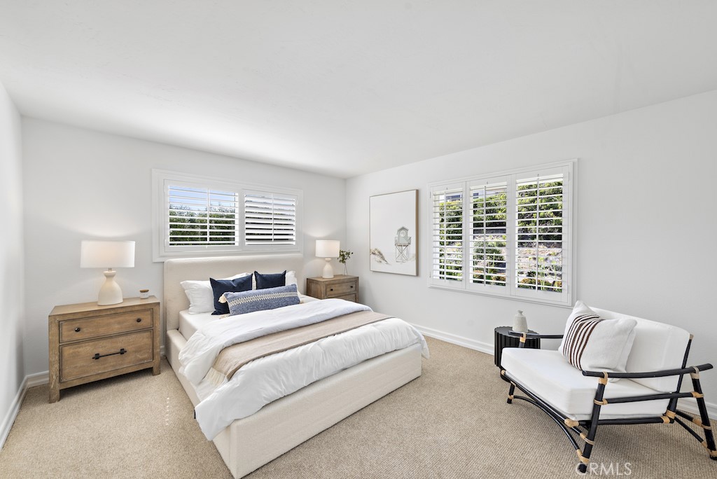 23242 Palawan Circle Dana Point, CA 92629 - Photo 20 of 34 a bedroom with a bed and a couch