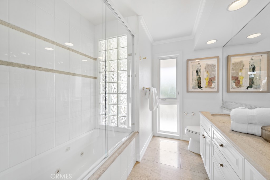 23242 Palawan Circle Dana Point, CA 92629 - Photo 21 of 34 a bathroom with a tub sink and mirror