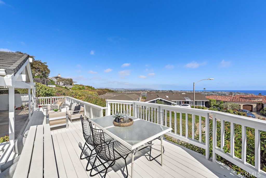 23242 Palawan Circle Dana Point, CA 92629 - Photo 23 of 34 a view of a balcony with wooden floor and seating space