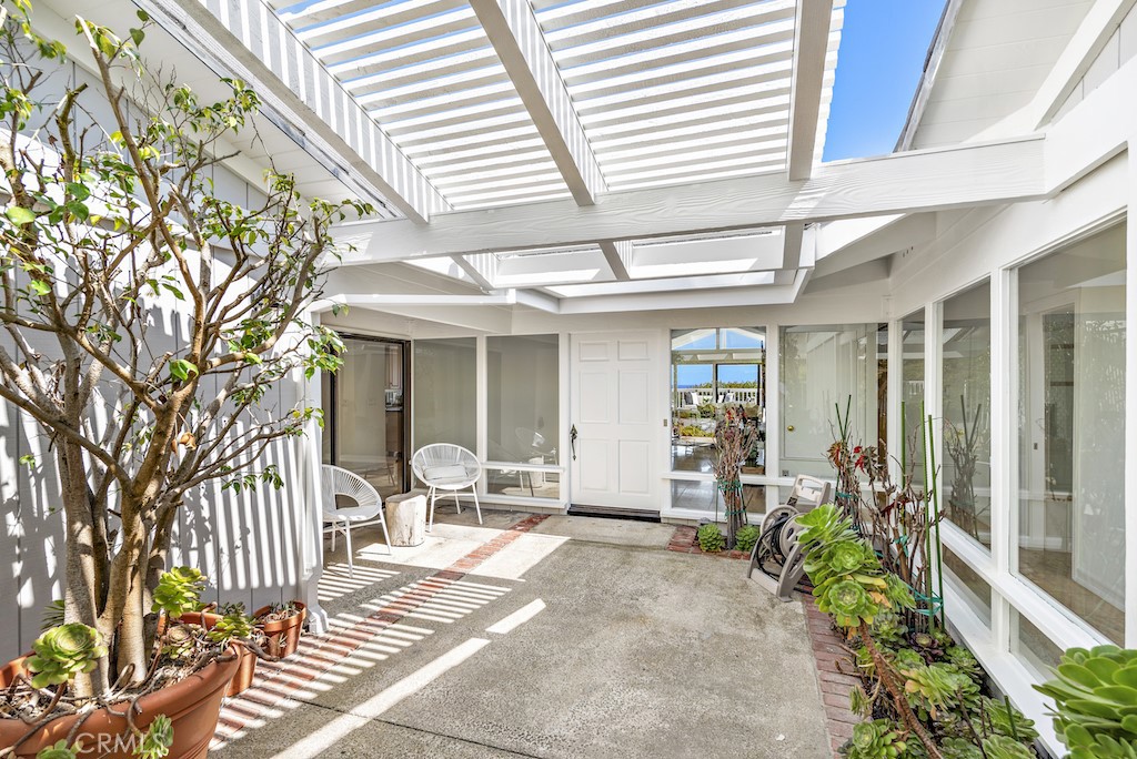 23242 Palawan Circle Dana Point, CA 92629 - Photo 3 of 34 a front view of a house with outdoor seating