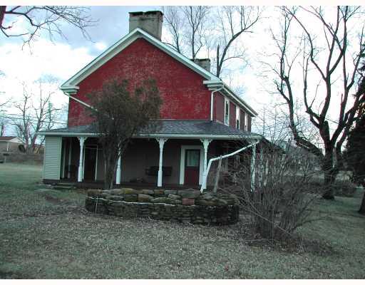 895 Webster Hollow Road Webster, PA 15087 - Photo 2 of 8 Exterior Front. Large wrap-around porch; fish pond; 1-Acre of ground +/- subject to subdivision