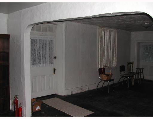 895 Webster Hollow Road Webster, PA 15087 - Photo 3 of 8 Dining Room. Open area could be dining room/living room/family room; wood floors; original windows on main level