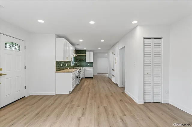 a view of kitchen with wooden floor