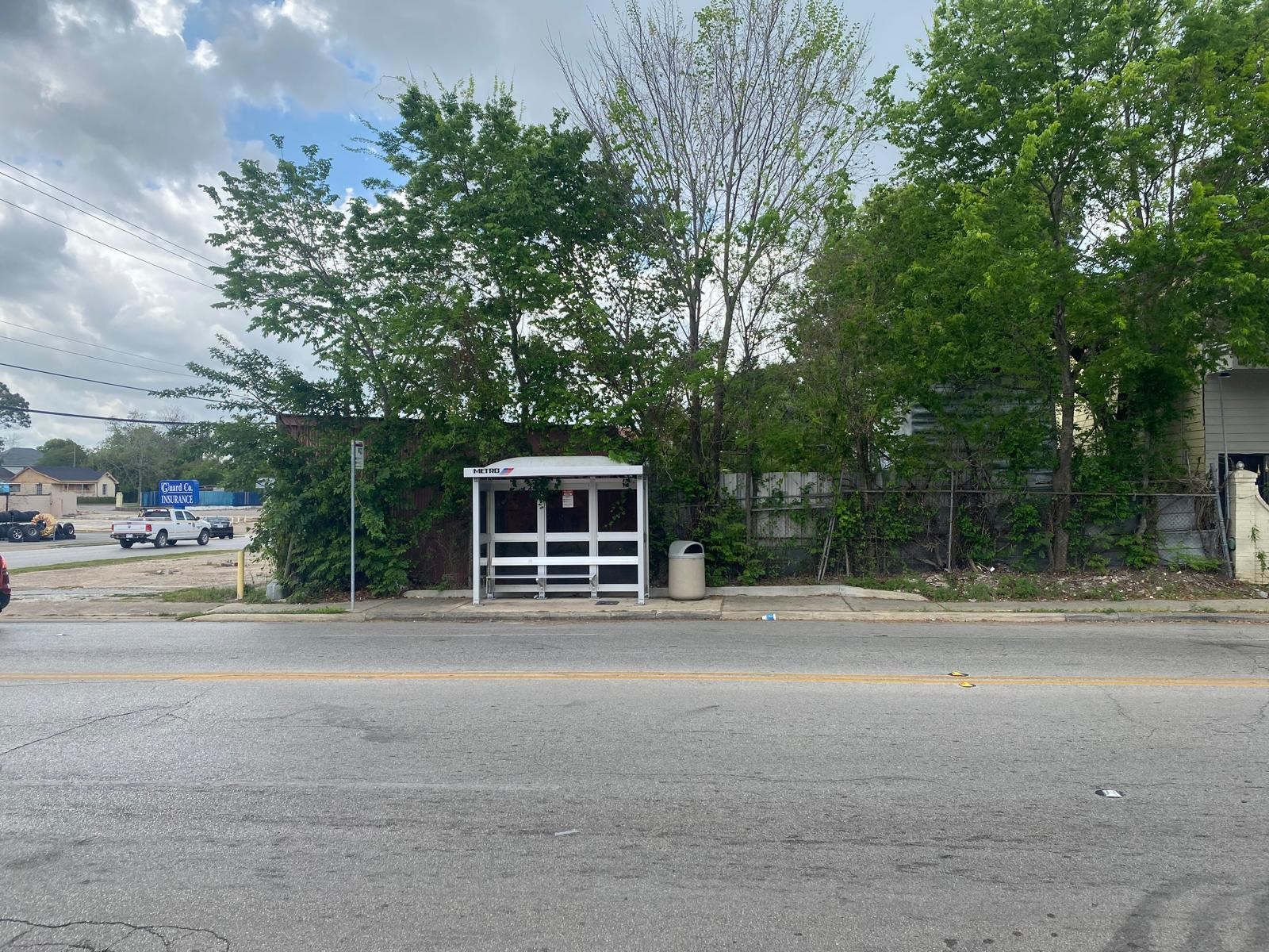 204 South 75th Street Houston, TX 77011 - Photo 12 of 15 a front view of a house with a yard and trees