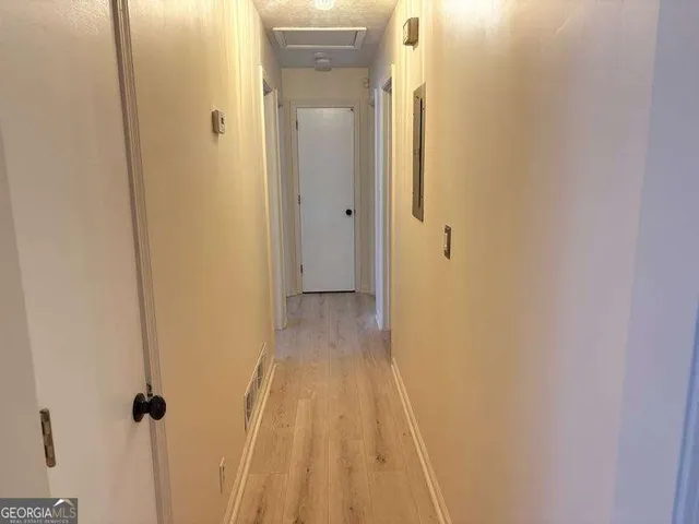 a view of a bathroom from a hallway