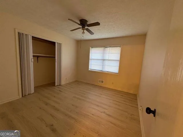 a view of empty room with windows