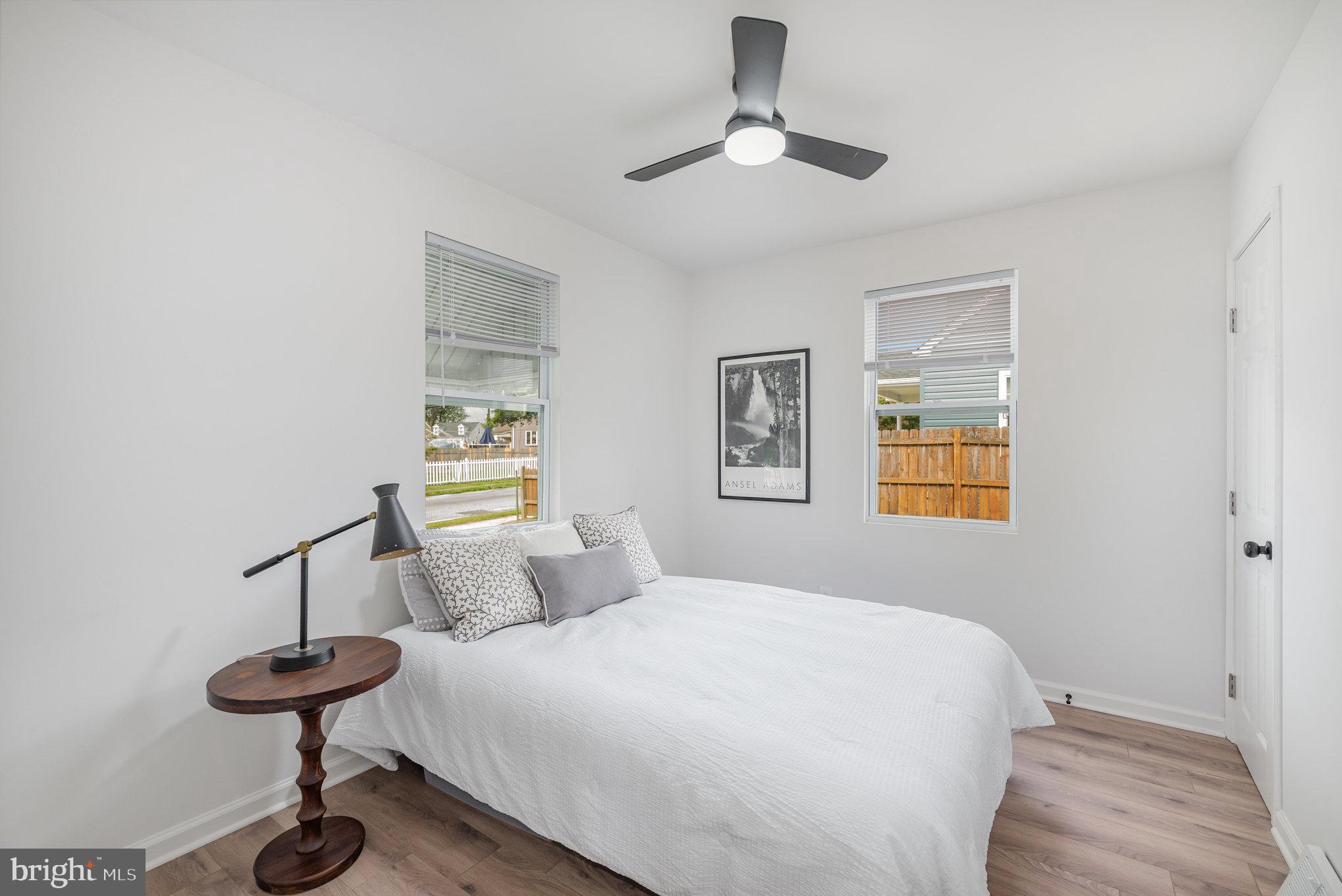 7 Terrace Road Essex, MD 21221 - Photo 14 of 25 a bedroom with a bed and a chandelier