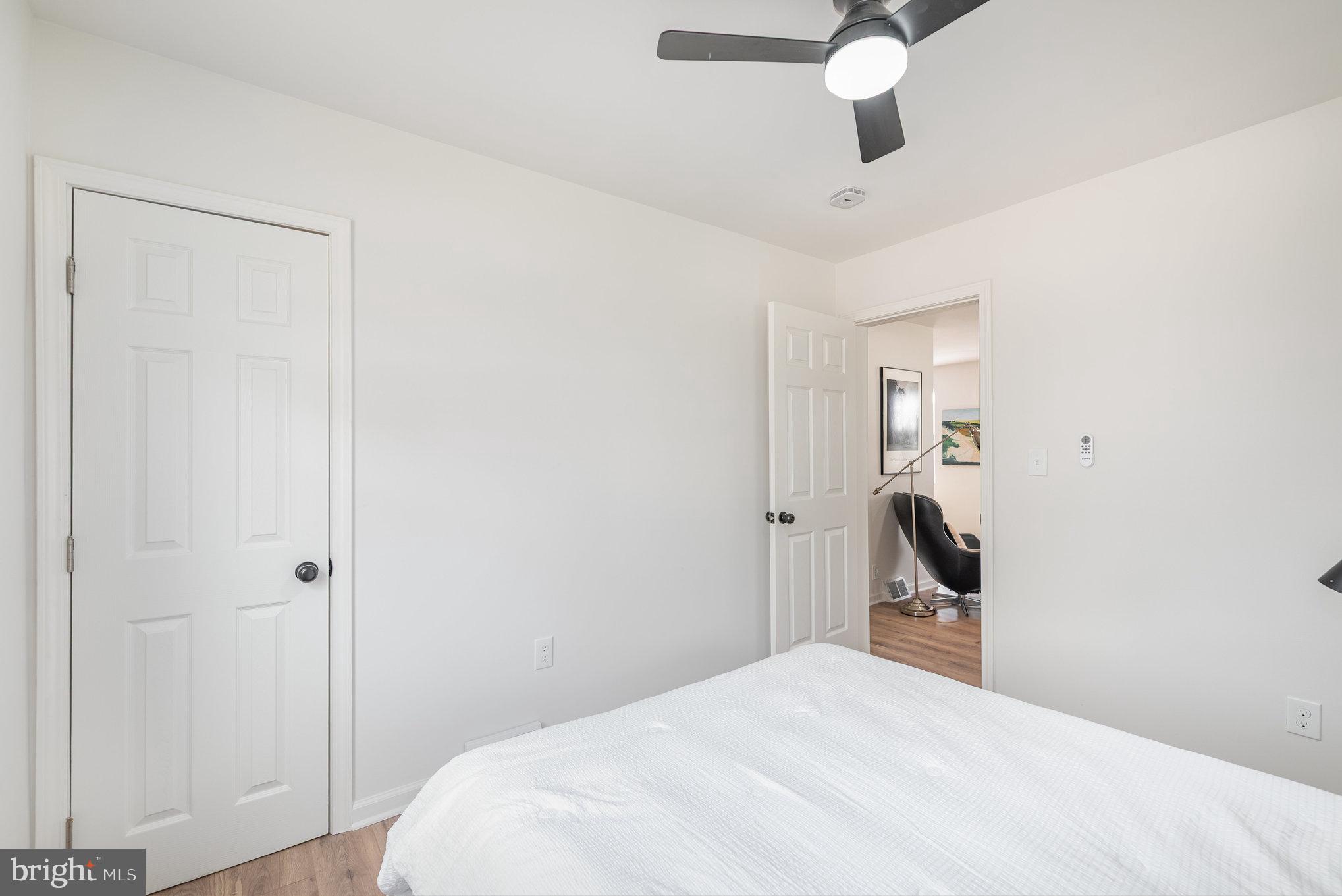 7 Terrace Road Essex, MD 21221 - Photo 15 of 25 a bedroom with a bed and a chandelier
