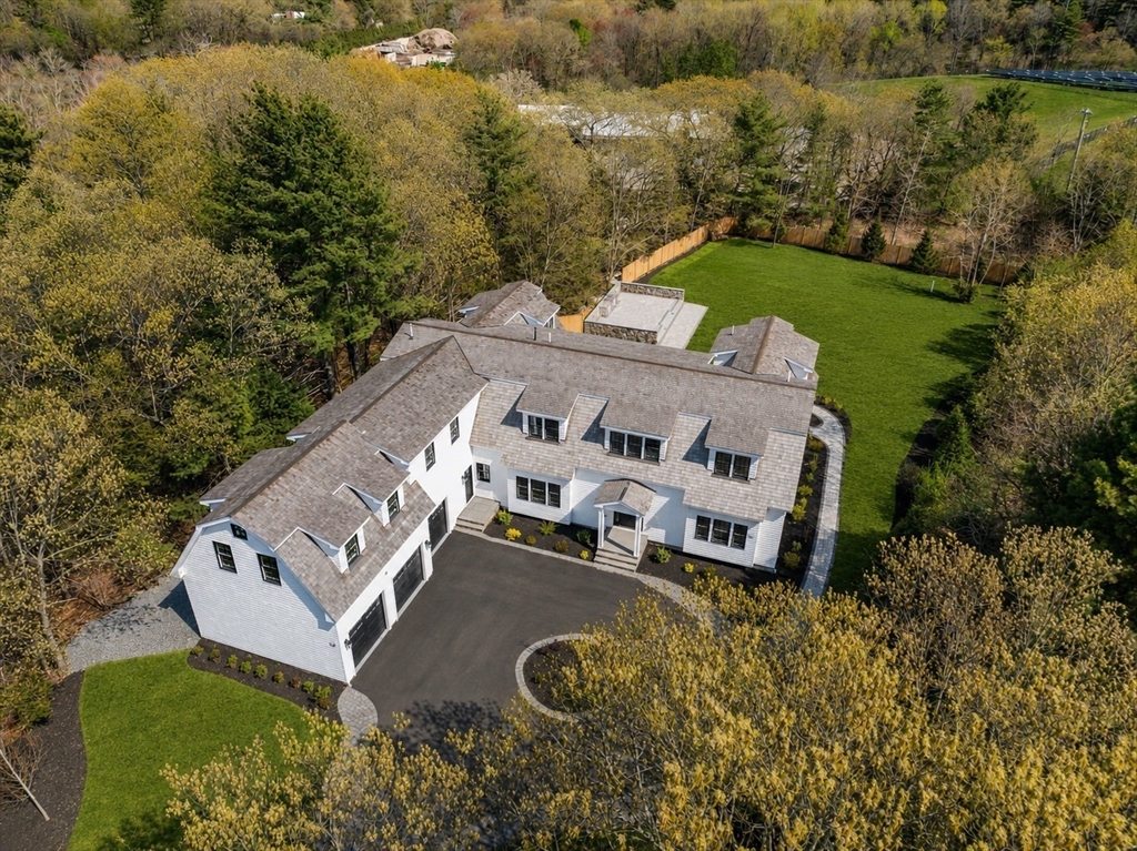 10 Hitching Post Lane Weston, MA 02493 - Photo 3 of 42 an aerial view of a house with garden space and outdoor seating