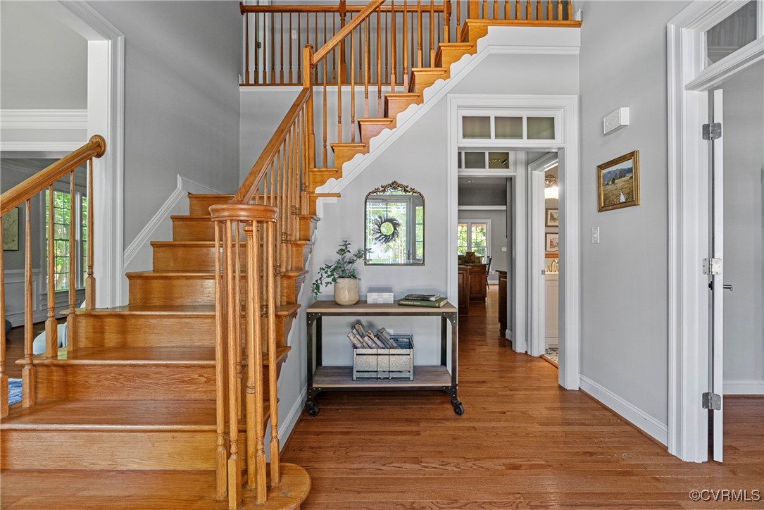 14136 Rigney Drive Midlothian, VA 23113 - Photo 2 of 50 a view of a hallway with wooden floor and staircase