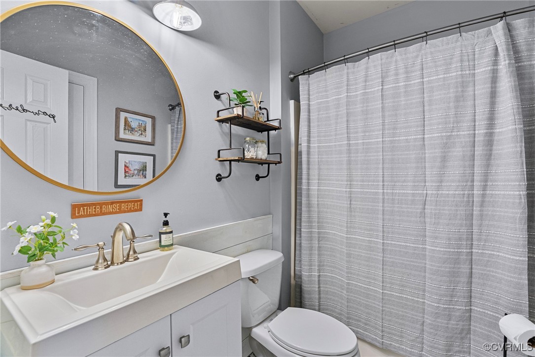 14136 Rigney Drive Midlothian, VA 23113 - Photo 23 of 50 a bathroom with a sink a toilet and shower