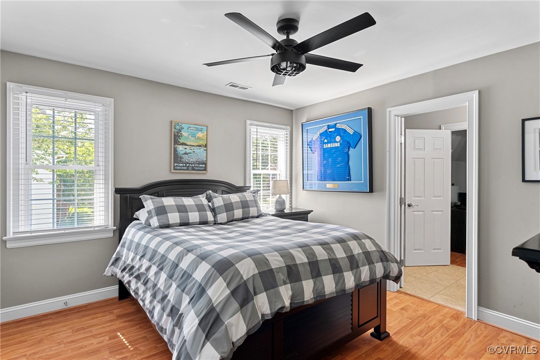 14136 Rigney Drive Midlothian, VA 23113 - Photo 38 of 50 a bedroom with a large bed and a window