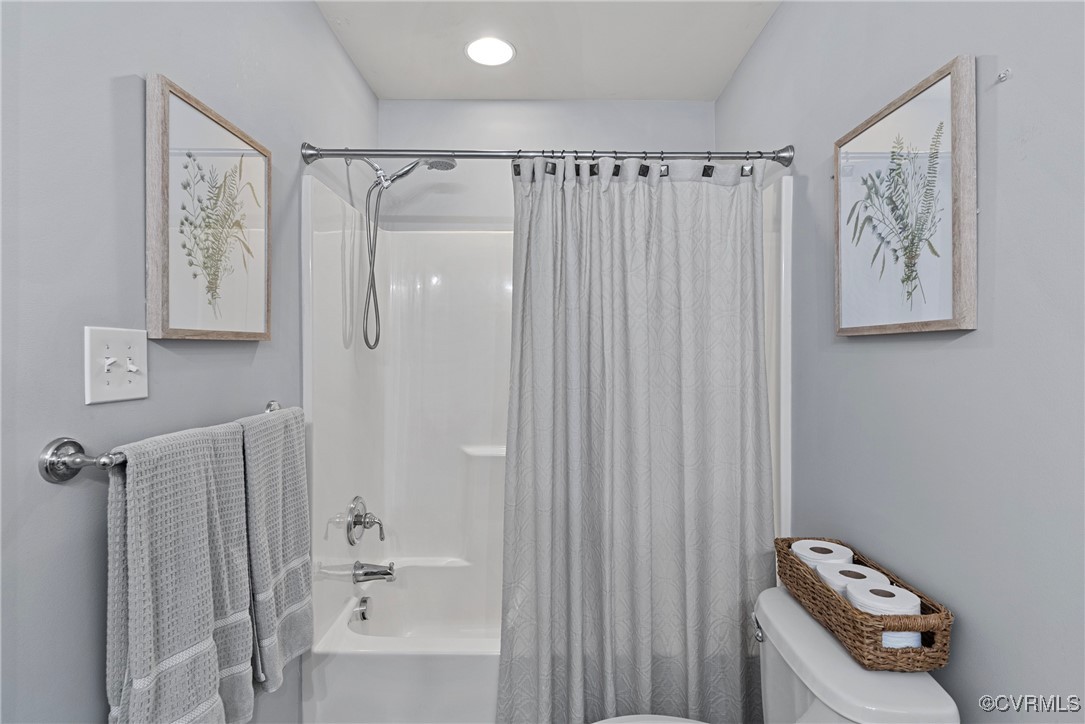 14136 Rigney Drive Midlothian, VA 23113 - Photo 40 of 50 a bathroom with a shower curtain and a sink