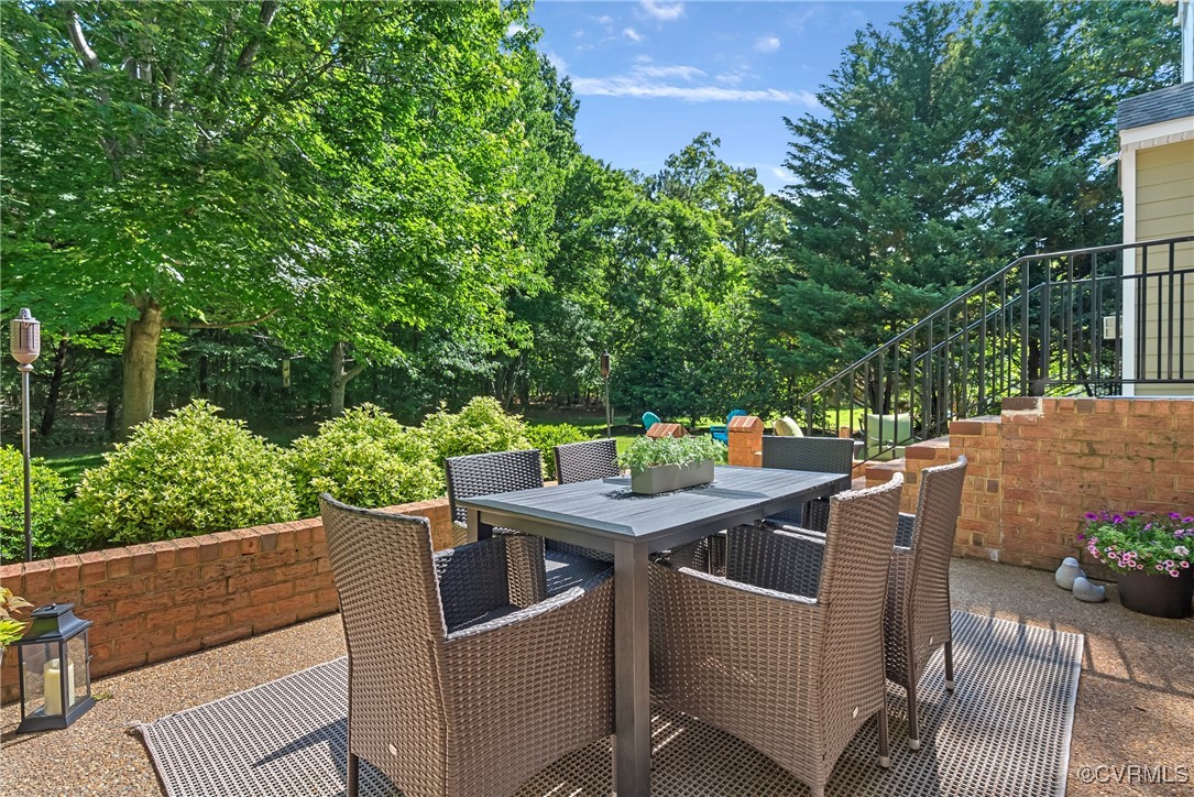 14136 Rigney Drive Midlothian, VA 23113 - Photo 45 of 50 a patio with table and chairs
