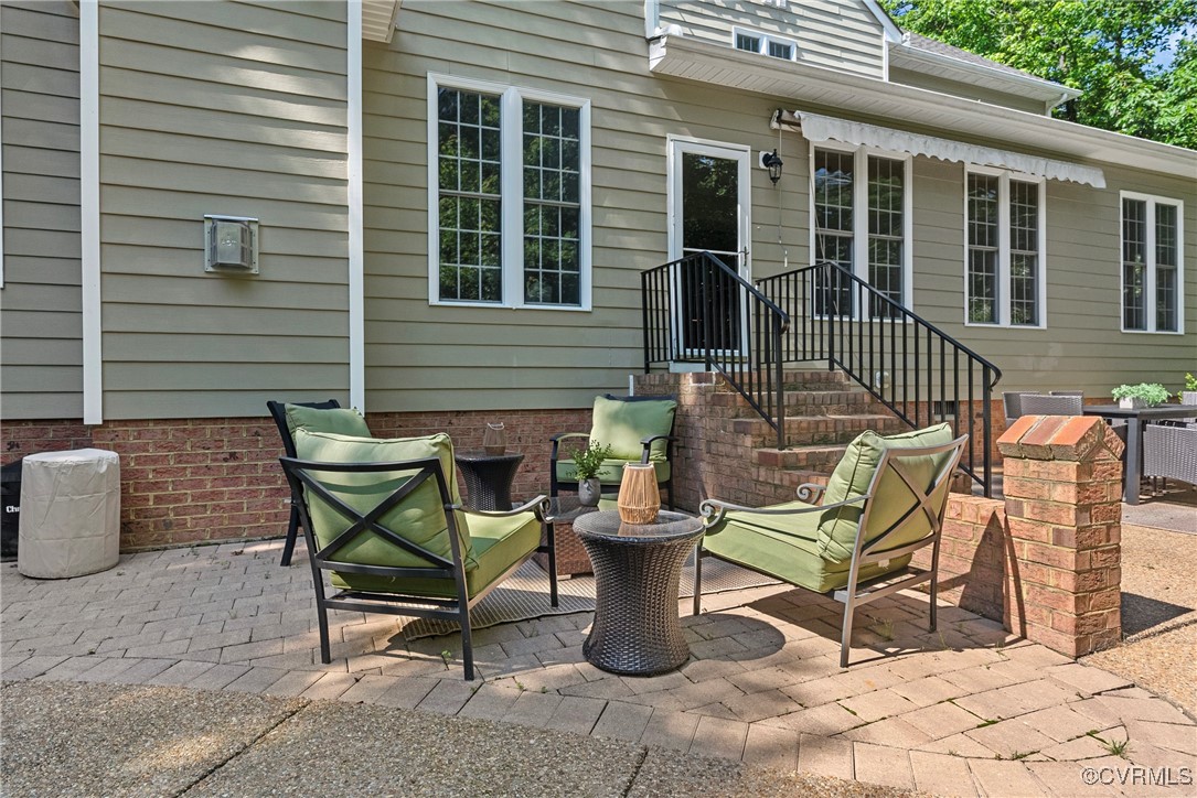 14136 Rigney Drive Midlothian, VA 23113 - Photo 46 of 50 a view of a patio with couple of chairs