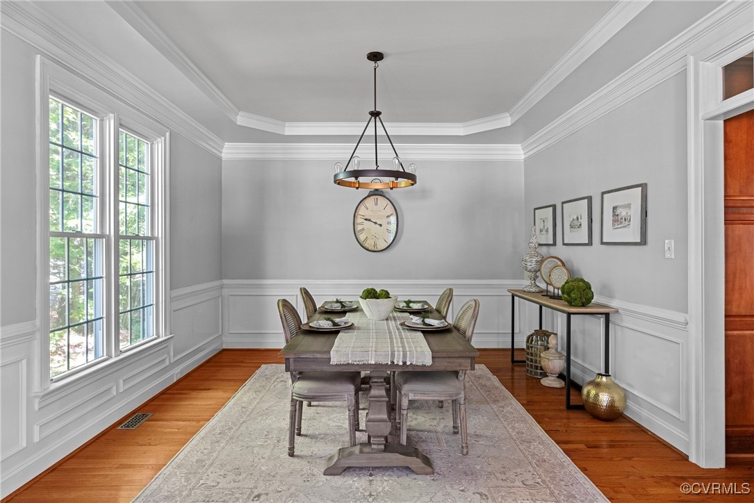 14136 Rigney Drive Midlothian, VA 23113 - Photo 8 of 50 a dining room with chandelier fan and wooden floor