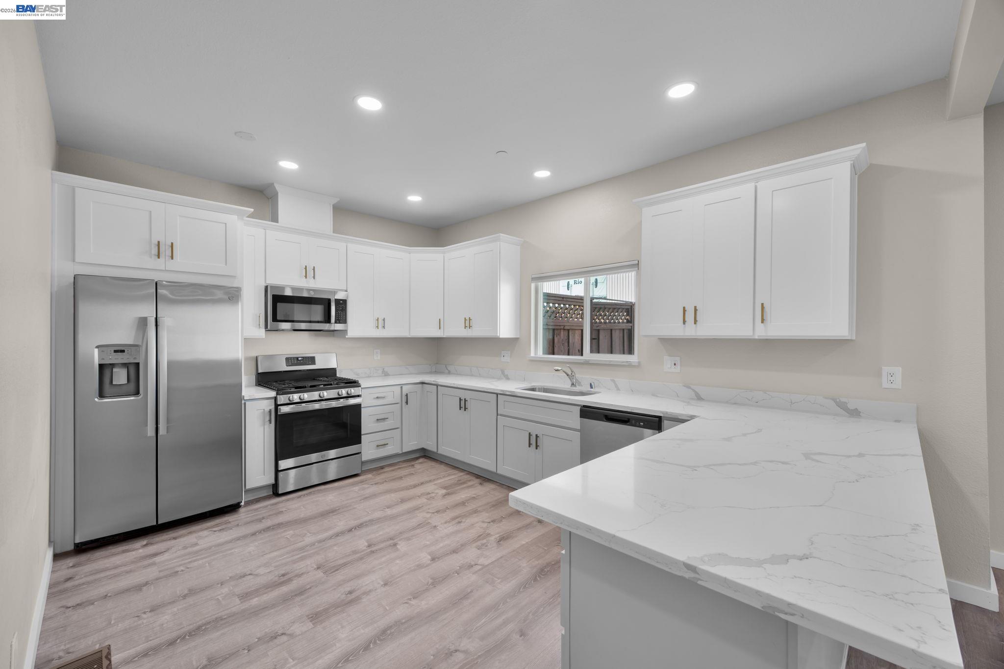 47 North 2nd Street Rio Vista, CA 94571 - Photo 7 of 21 a kitchen with stainless steel appliances kitchen island granite countertop a stove sink and refrigerator
