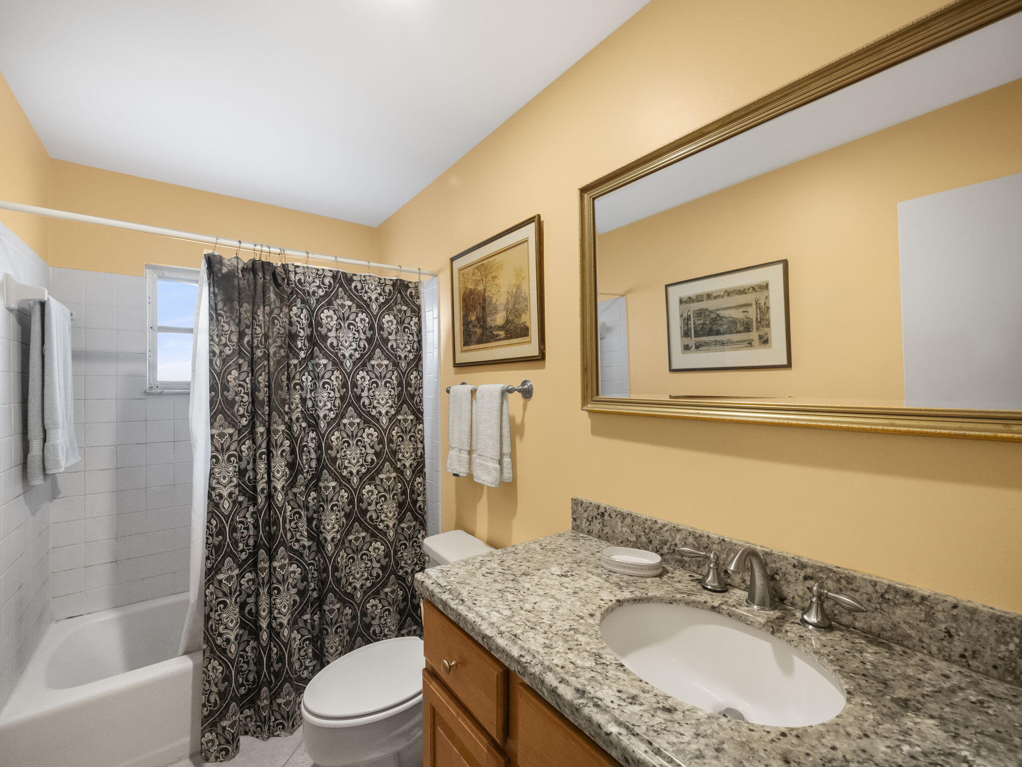 18390 Southeast Courtview Circle Jupiter, FL 33469 - Photo 11 of 16 a bathroom with a granite countertop sink toilet and shower
