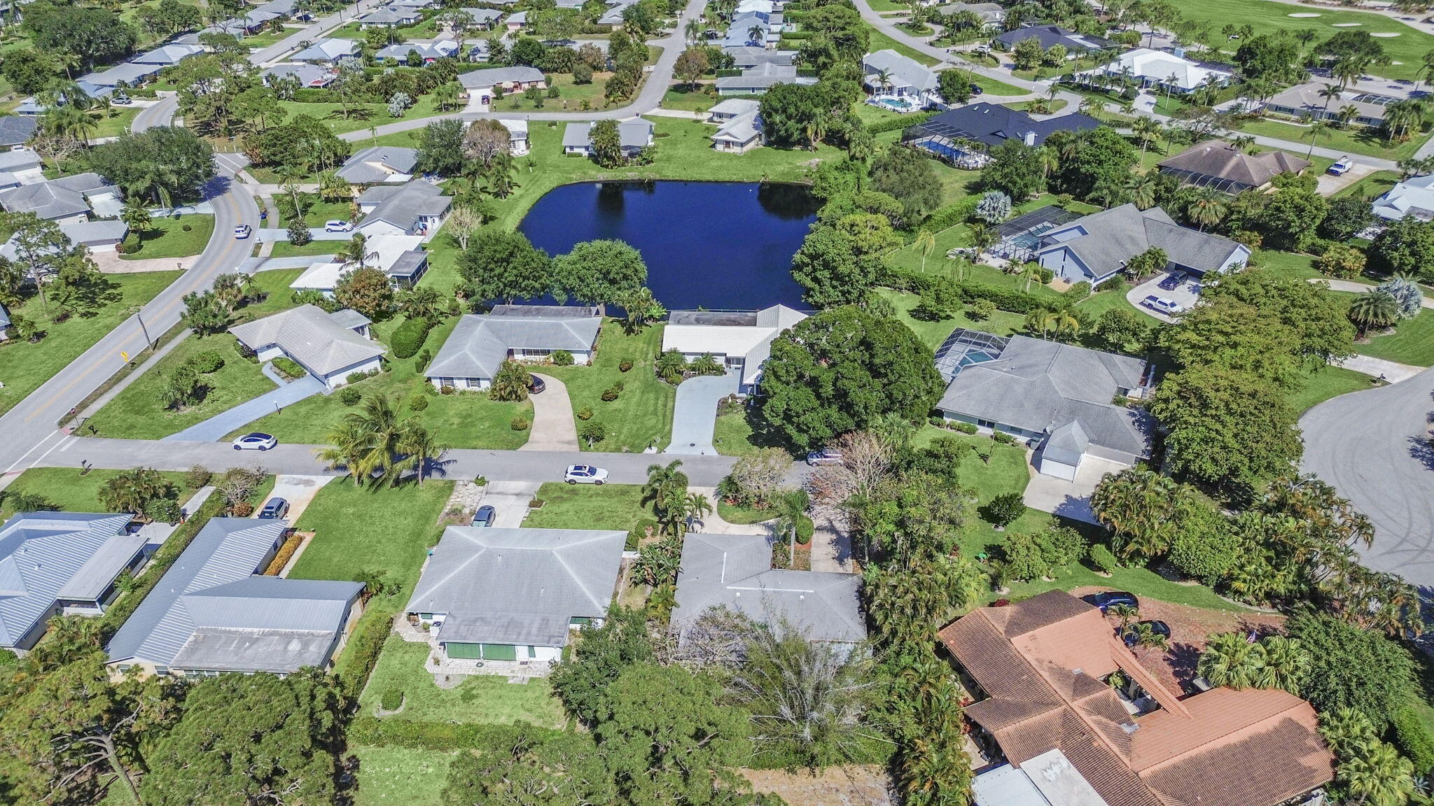 18390 Southeast Courtview Circle Jupiter, FL 33469 - Photo 16 of 16 an aerial view of residential houses with outdoor space