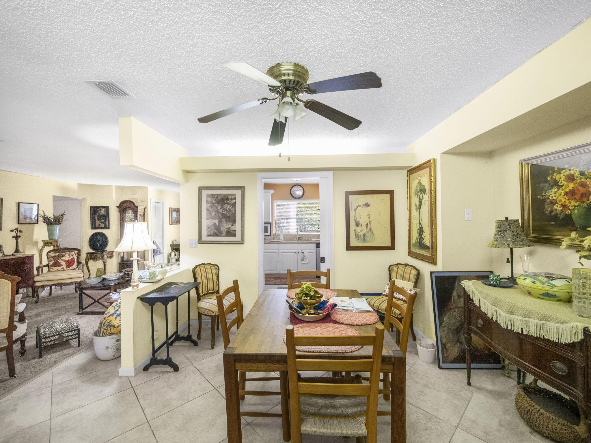 18390 Southeast Courtview Circle Jupiter, FL 33469 - Photo 6 of 16 a view of a dining room with furniture