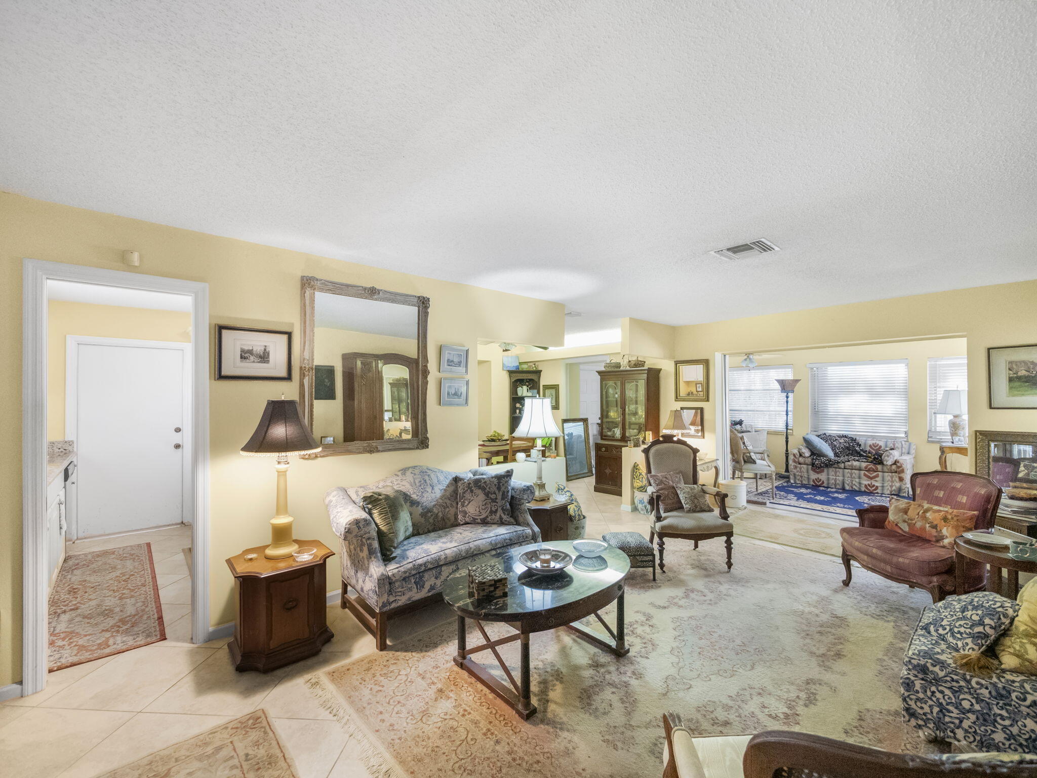 18390 Southeast Courtview Circle Jupiter, FL 33469 - Photo 8 of 16 a living room with furniture and a couch