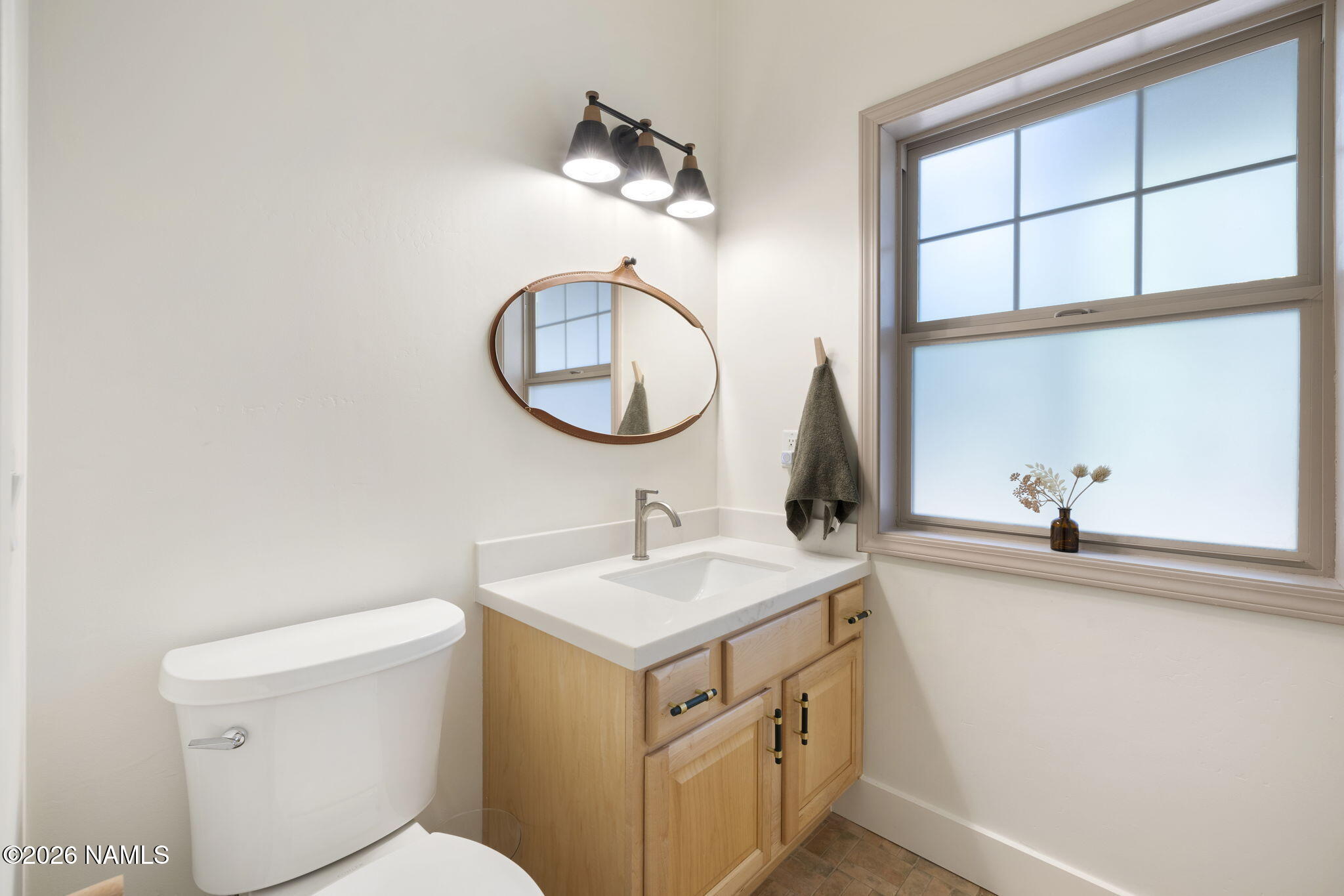 3495 West Lead Rope Flagstaff, AZ 86005 - Photo 18 of 49 a bathroom with a sink and a toilet