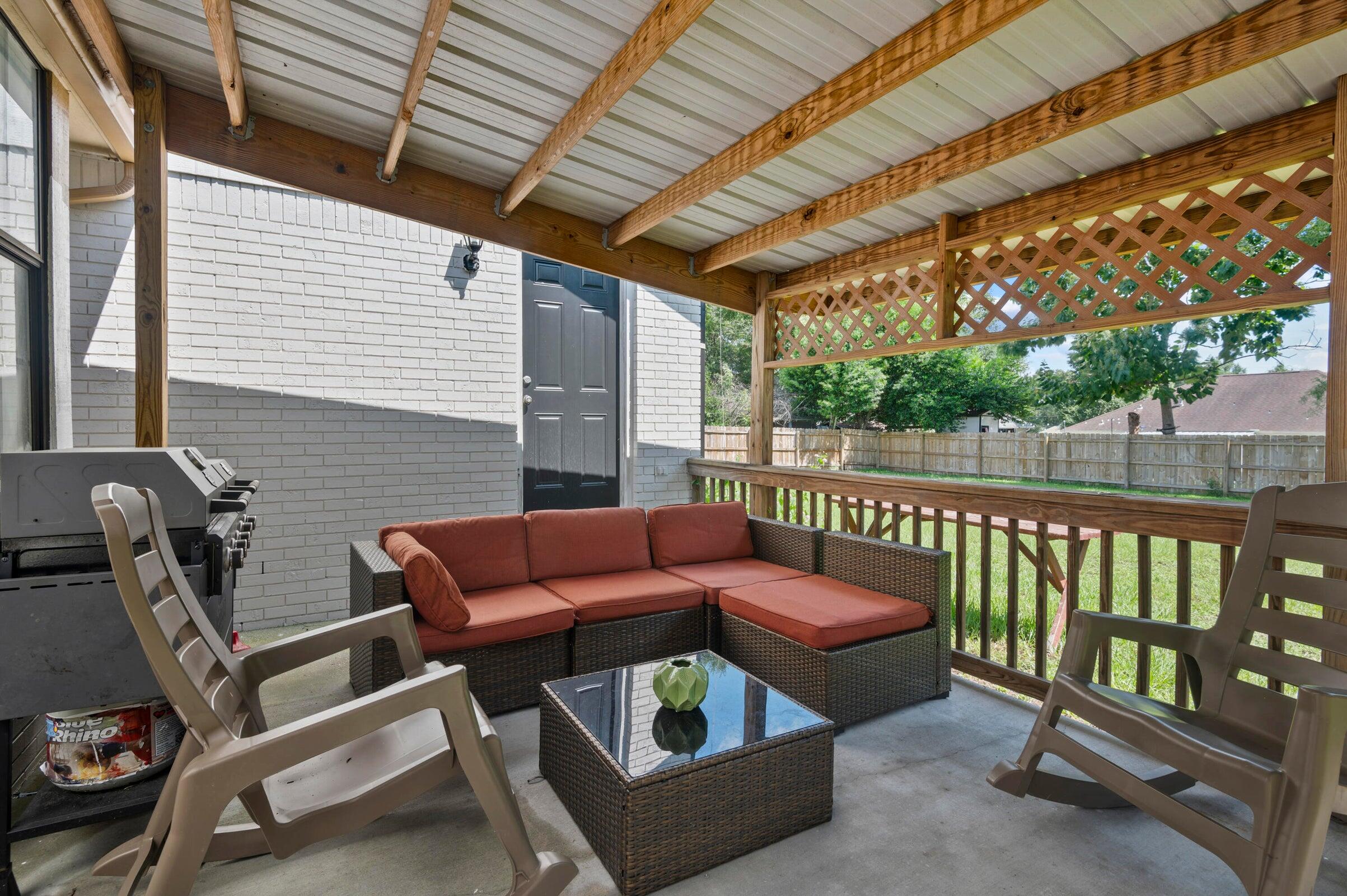 403 Juniper Drive Crestview, FL 32536 - Photo 19 of 25 a balcony with furniture and next to a window