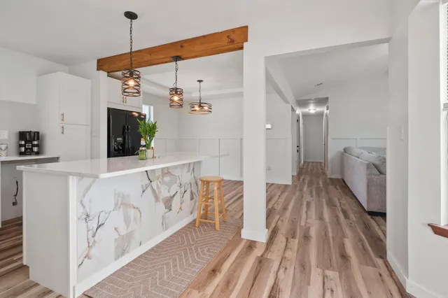 a view of a house with yard and sitting area