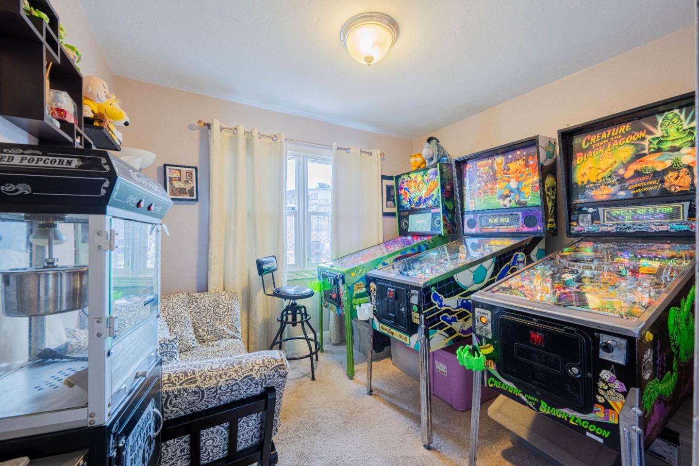 2080 Buchanan Street Seaside, CA 93955 - Photo 16 of 28 a living room with furniture a flat screen tv and a floor to ceiling window
