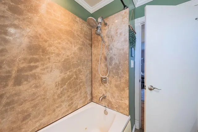 a bathroom with a shower and a bathtub