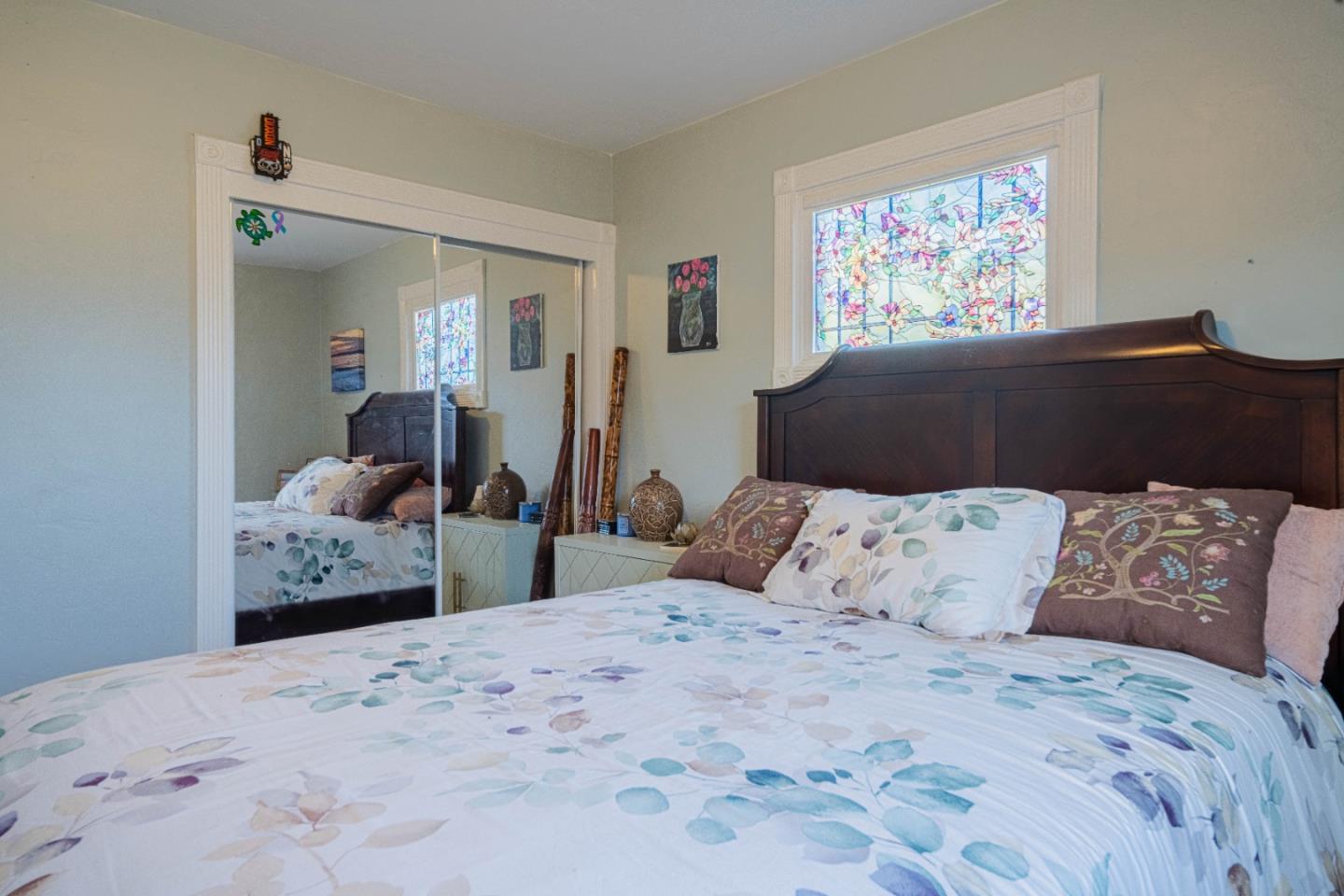 2080 Buchanan Street Seaside, CA 93955 - Photo 21 of 28 a bedroom with a large bed and painting on the wall
