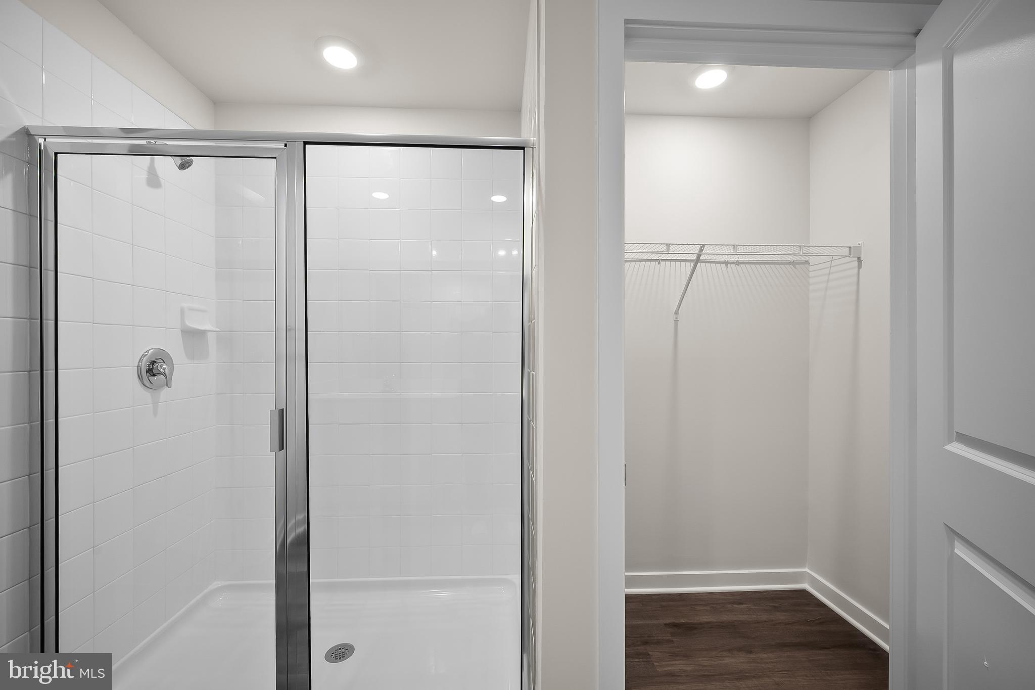 293 Eclipse Street Ranson, WV 25438 - Photo 19 of 39 a bathroom with a shower and a glass door