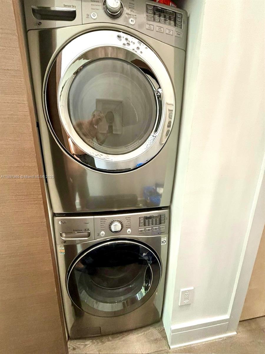 221 Jefferson Avenue, Unit 4 Miami Beach, FL 33139 - Photo 16 of 34 a utility room with dryer and washer