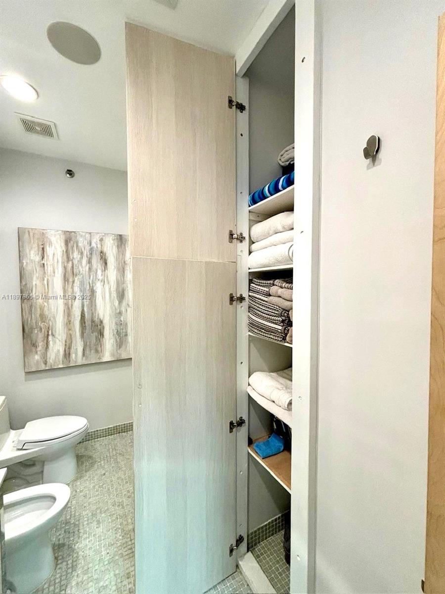 221 Jefferson Avenue, Unit 4 Miami Beach, FL 33139 - Photo 19 of 34 a bathroom with a toilet and a shower