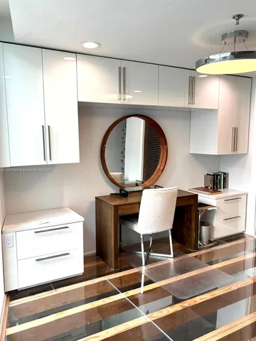a kitchen with a sink cabinets and window