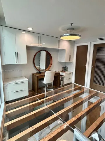 a kitchen with a stove and a table