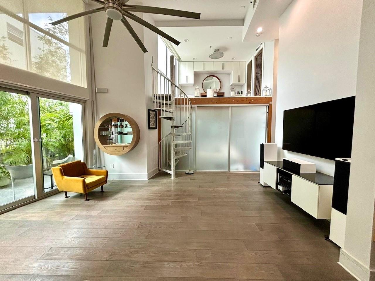 221 Jefferson Avenue, Unit 4 Miami Beach, FL 33139 - Photo 3 of 34 a living room with furniture and a flat screen tv