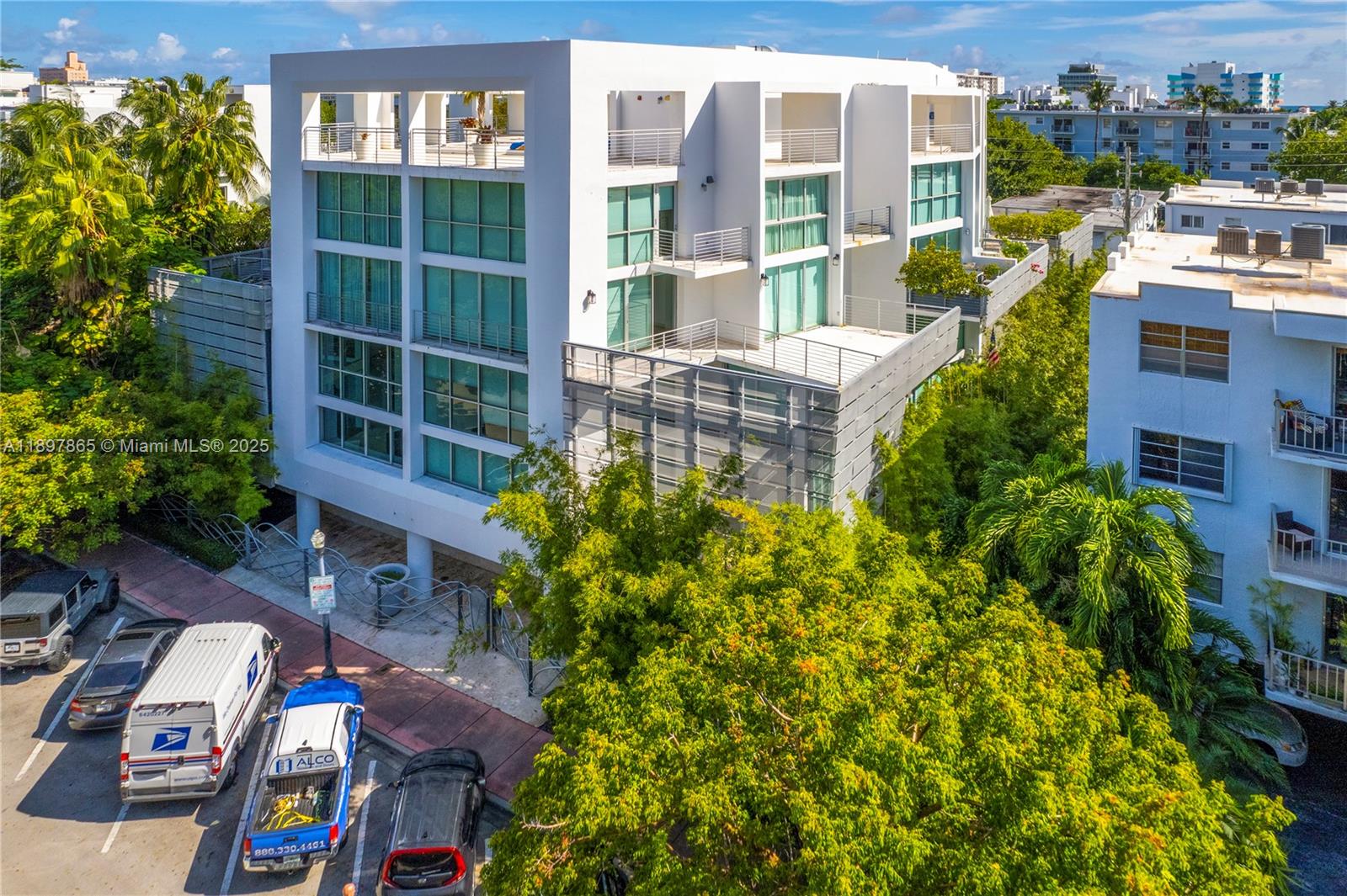 221 Jefferson Avenue, Unit 4 Miami Beach, FL 33139 - Photo 31 of 34 a view of a swimming pool with a lounge chairs