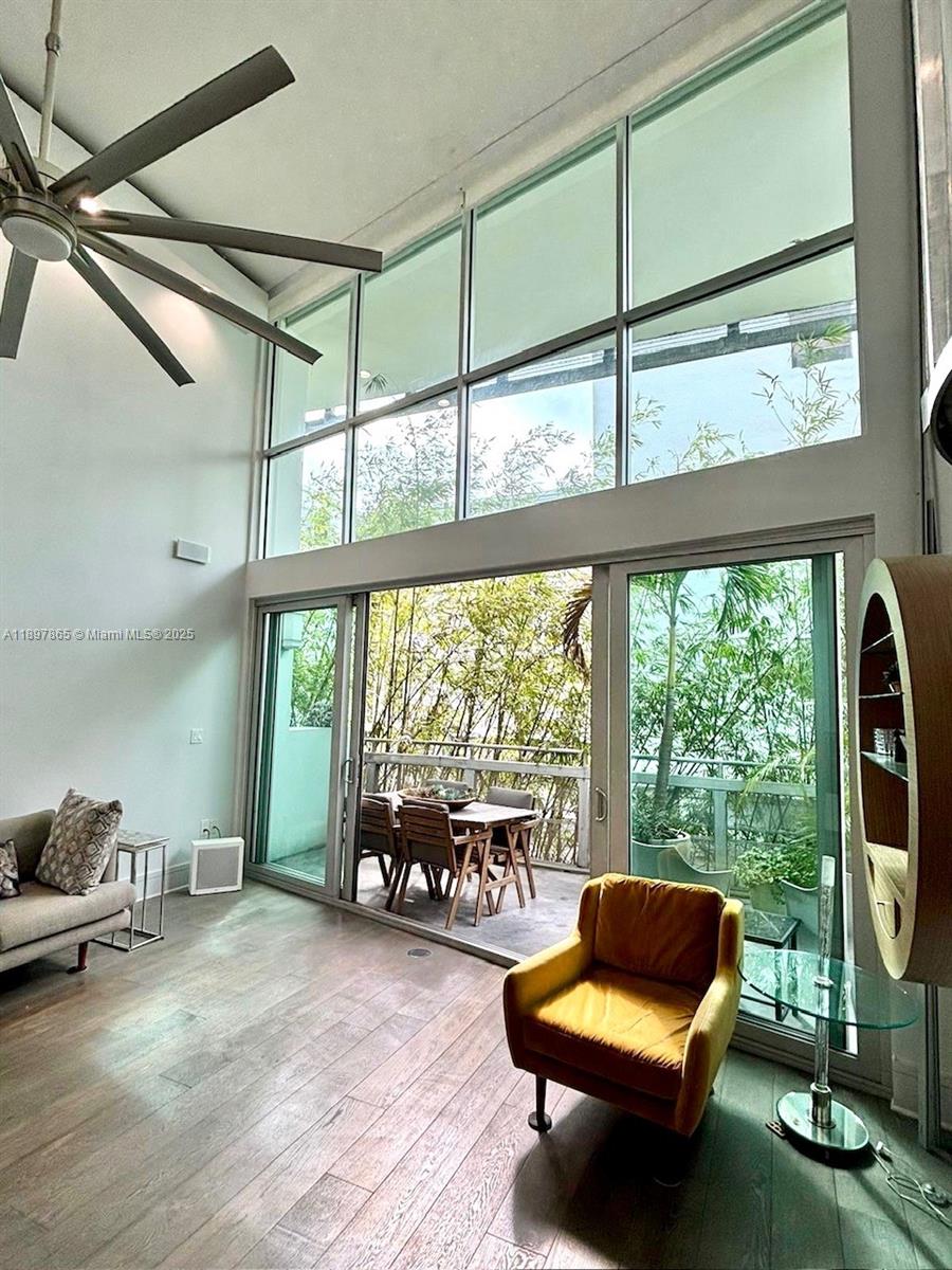 221 Jefferson Avenue, Unit 4 Miami Beach, FL 33139 - Photo 6 of 34 a living room with furniture and a floor to ceiling window