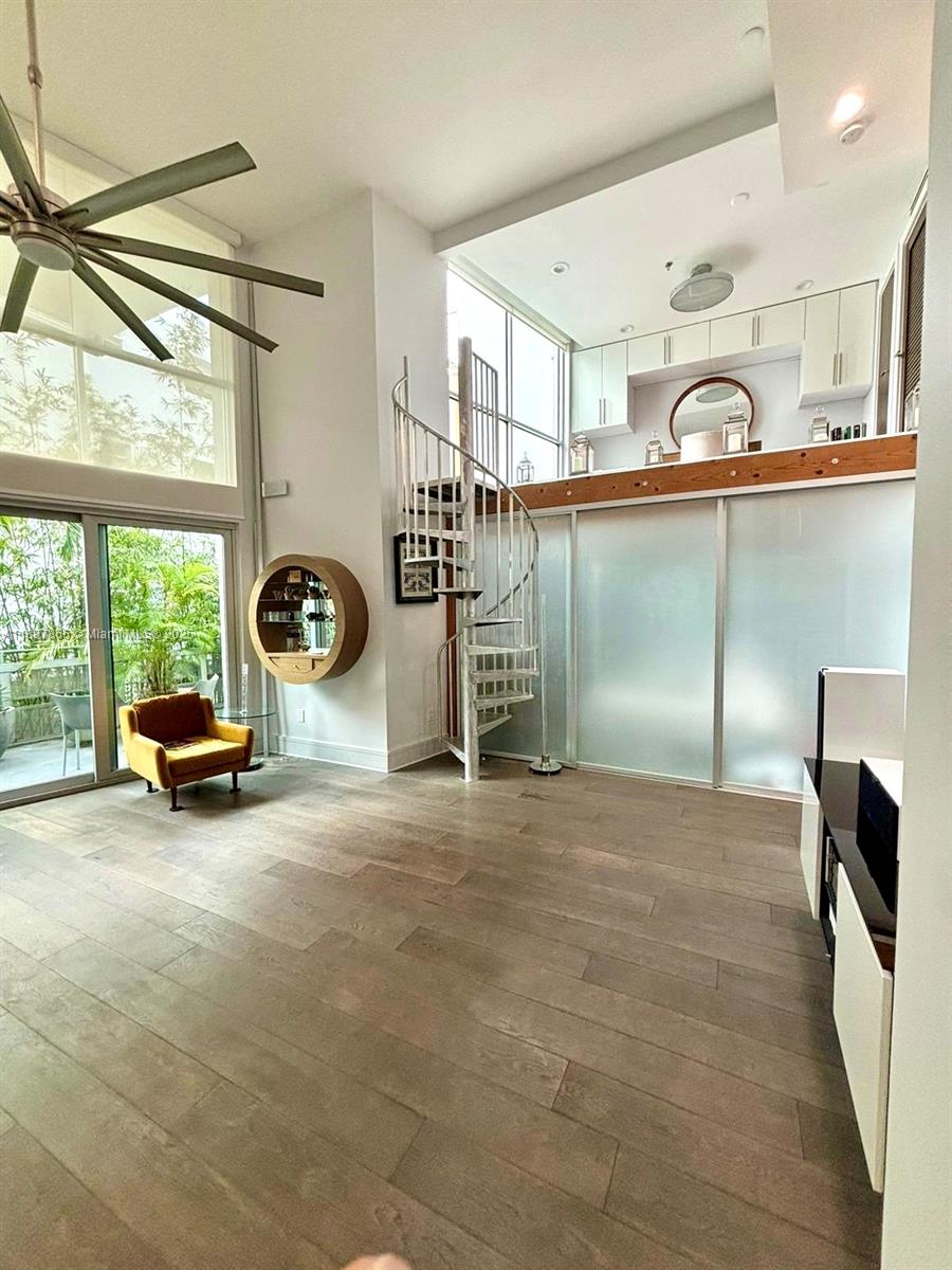 221 Jefferson Avenue, Unit 4 Miami Beach, FL 33139 - Photo 7 of 34 a view of a livingroom with furniture and windows